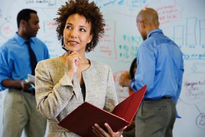 MRW African Businesswoman Brainstorming With Co Workers