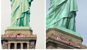 Refugees Welcome banner hung across the Statue of Liberty